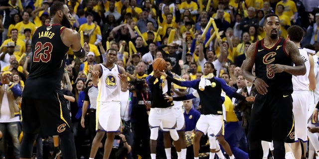 LeBron James, #23, and JR Smith, #5 of the Cleveland Cavaliers, react as time expries in regulation against the Golden State Warriors in Game 1 of the 2018 NBA Finals at ORACLE Arena on May 31, 2018 in Oakland, California.