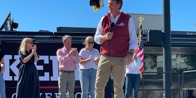 Republican Gov. Glenn Youngkin of Virginia speaks on behalf of GOP Gov. Brian Kemp of Georgia at a Kemp re-election rally on Sept. 27, 2022 in Alpharetta, Georgia