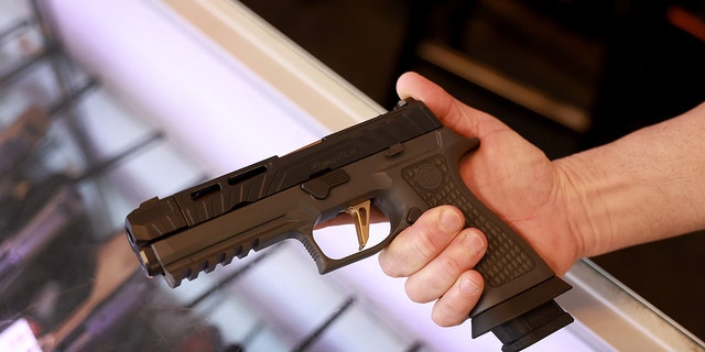 A Sig Sauer P320 handgun at the WEX Gunworks store Jan. 31, 2023, in Delray Beach, Fla. 