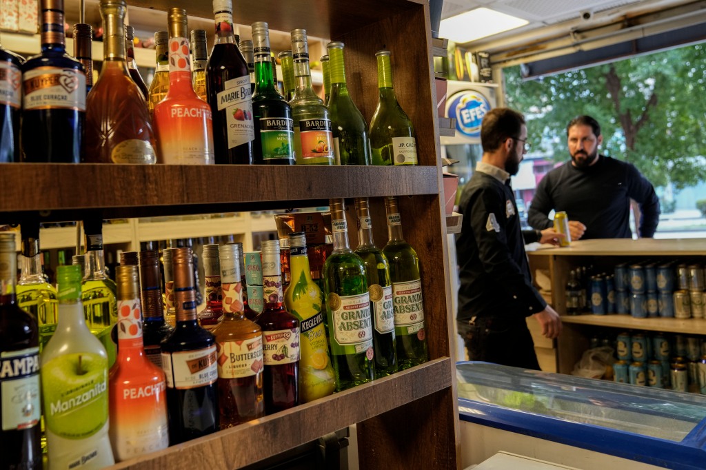 Bottles of liquor sit on a shelf in a liquor store in Iraq's capital on March 9, 2023.