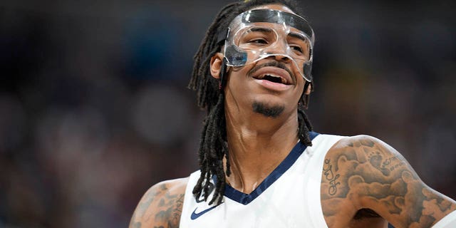 Memphis Grizzlies guard Ja Morant looks to the bench during the second half of the Nuggets game on Friday, March 3, 2023, in Denver.