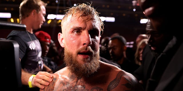 Jake Paul exits the ring after his unanimous decision win over Anderson Silva of Brazil in their cruiserweight bout at Desert Diamond Arena on October 29, 2022 in Glendale, Arizona.