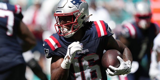 Jakobi Meyers of the New England Patriots rushes the football in the fourth quarter of a game against the Miami Dolphins at Hard Rock Stadium Sept. 11, 2022, in Miami Gardens, Fla. 