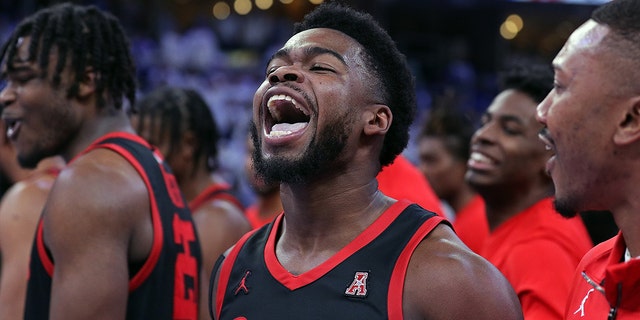 Jamal Shead of the Houston Cougars celebrates after making the game-winning shot against the Memphis Tigers at FedExForum on March 5, 2023.