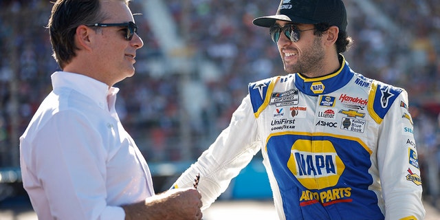 Chase Elliott, driver of the No. 9 NAPA Auto Parts Chevrolet, and Jeff Gordon, vice chairman of Hendrick Motorsports, talk prior to the NASCAR Cup Series Championship at Phoenix Raceway Nov. 6, 2022, in Avondale, Ariz.