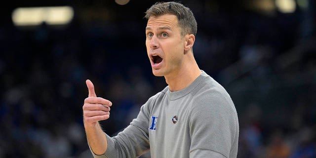 Duke head coach Jon Scheyer calls out instructions during the first half of a first-round college basketball game against Oral Roberts in the NCAA Tournament, Thursday, March 16, 2023, in Orlando, Fla. 