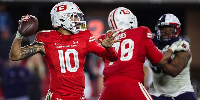 Jordan Ta'amu, #10 of the DC Defenders, attempts a pass against the Houston Roughnecks during the second half of the XFL game at Audi Field on March 27, 2023 in Washington, D.C.