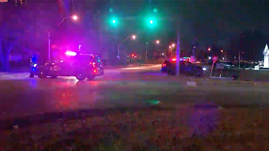 Police cars near the scene of a shooting in Kansas City