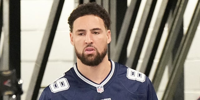 Klay Thompson #11 of the Golden State Warriors arrives to the arena prior to the game against the Dallas Mavericks on March 22, 2023 at the American Airlines Center in Dallas, Texas.