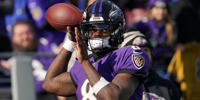 Baltimore Ravens quarterback Lamar Jackson, #8, warms up prior to the game against the Denver Broncos at M&amp;T Bank Stadium in Baltimore Dec. 4, 2022.