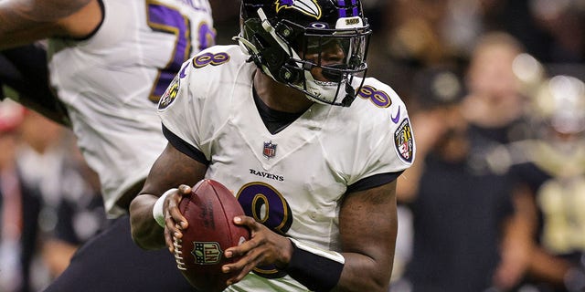 Nov 7, 2022; New Orleans, Louisiana, USA; Baltimore Ravens quarterback Lamar Jackson (8) scrambles against the New Orleans Saints during the first half at Caesars Superdome.