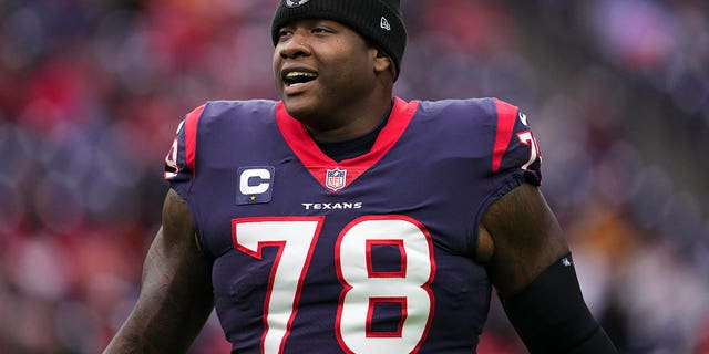 Laremy Tunsil of the Texans runs onto the field for the Kansas City Chiefs game at NRG Stadium on Dec. 18, 2022, in Houston.