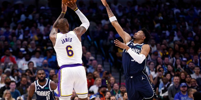 LeBron James (6) of the Los Angeles Lakers shoots the ball as Christian Wood (35) of the Dallas Mavericks defends in the first half of a game at American Airlines Center Feb. 26, 2023, in Dallas, Texas.