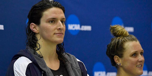 Lia Thomas, left, looks on from the podium after finishing fifth in the 200 Yard Freestyle during the 2022 NCAA Division I Women's Swimming &amp; Diving Championship at the McAuley Aquatic Center on the campus of the Georgia Institute of Technology on March 18, 2022 in Atlanta.