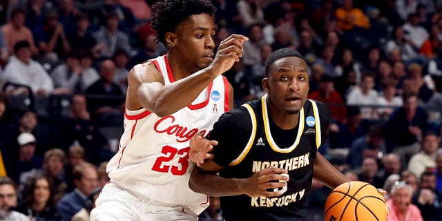 Northern Kentucky guard Marques Warrick (3) drives to the basket around Houston guard Terrance Arceneaux (23) during the second half of a first-round college basketball game in the men's NCAA Tournament in Birmingham, Ala., Thursday, March 16, 2023.