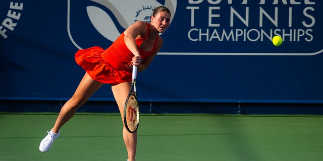 Marta Kostyuk of Ukraine in action against Belinda Bencic of Switzerland during her second round match on Day 3 of the Dubai Duty Free Tennis at Dubai Duty Free Tennis Stadium on February 21, 2023 in Dubai, United Arab Emirates. 