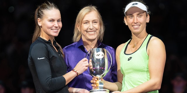 Martina Navratilova, center, poses with Elise Mertens, right, and Veronika Kudermetova after they won the doubles final against Barbora Krejcikova and Katerina Siniakova at the WTA Finals at Dickies Arena Nov 7, 2022, in Forth Worth, Texas. 