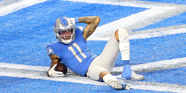 Detroit Lions wide receiver Marvin Jones poses after scoring during the second half of a game against the Minnesota Vikings in Detroit Jan. 3, 2021.