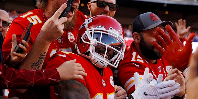 Mecole Hardman #17 of the Kansas City Chiefs celebrates with fans after scoring a touchdown during the third quarter against the Buffalo Bills at Arrowhead Stadium on October 16, 2022 in Kansas City, Missouri.