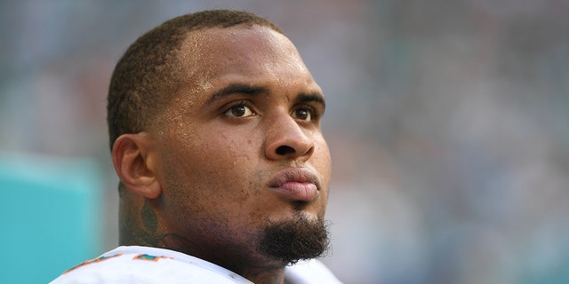 Mike Pouncey of the Miami Dolphins on the sideline during a game against the New York Jets at Hard Rock Stadium Oct. 22, 2017, in Miami Gardens, Fla.