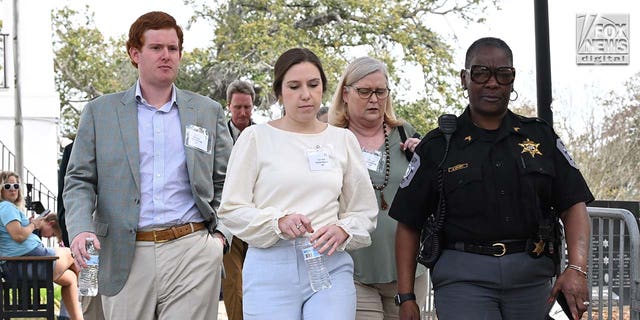 Buster Murdaugh, Brooklynn White and Lynn Murdaugh leave the Colleton County Courthouse for a lunch break Wednesday, March 1, 2023, in South Carolina.