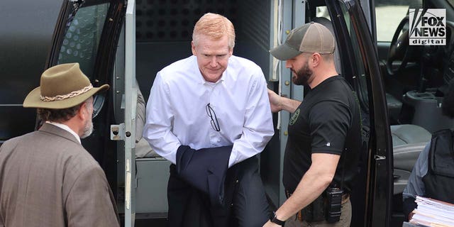 Alex Murdaugh, center, is led into the Colleton County courthouse in Walterboro, South Carolina on Wednesday, March 1, 2023. Murdaugh is on trial for the double slaying of his son, Paul, and wife, Maggie, in June 2021.