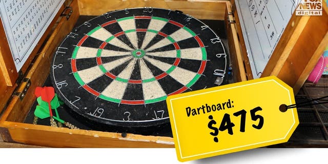 A dart board with Buster Murdaugh's name written on a scoreboard sold for $475.