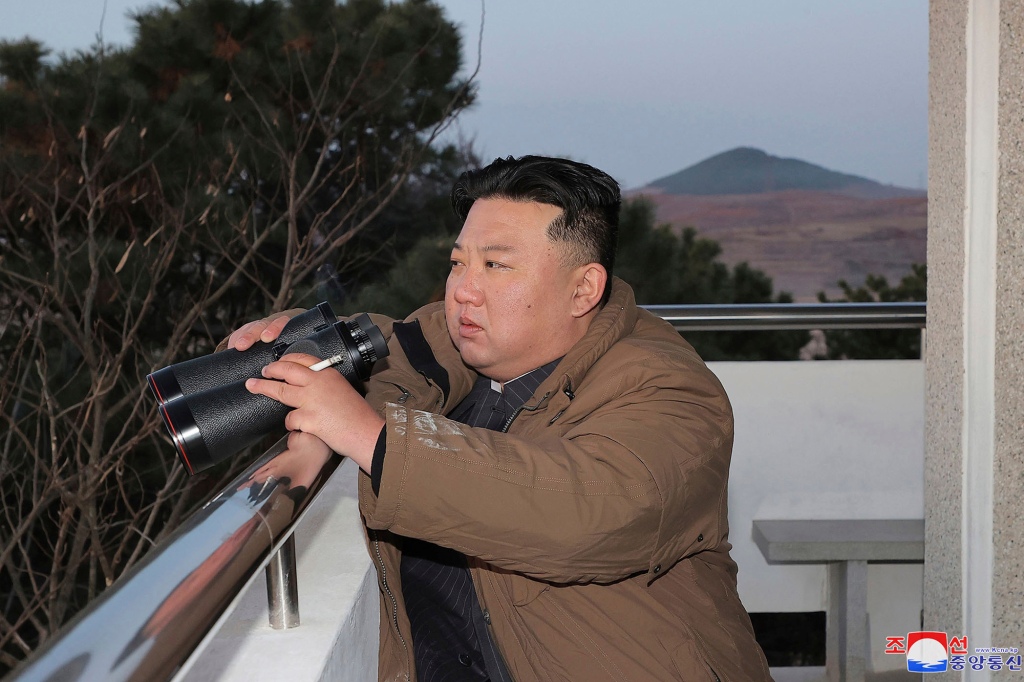 North Korean leader Kim Jong Un watches what it says is an intercontinental ballistic missile the country test-launched at the Sunan international airport in Pyongyang, North Korea, Thursday, March 16, 2023