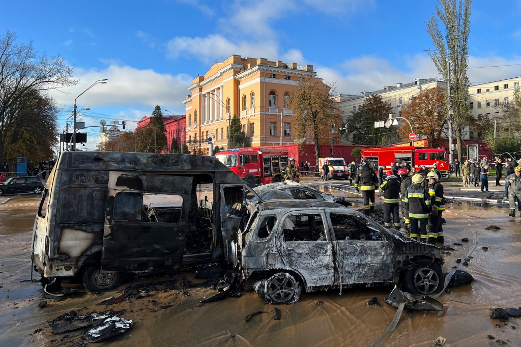 Rescue workers are pictured at the scene of a Russian attack on Kyiv in October 2022.