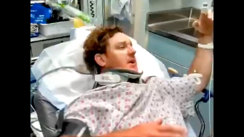 Christopher Kunzelman is pictured in a hospital bed.