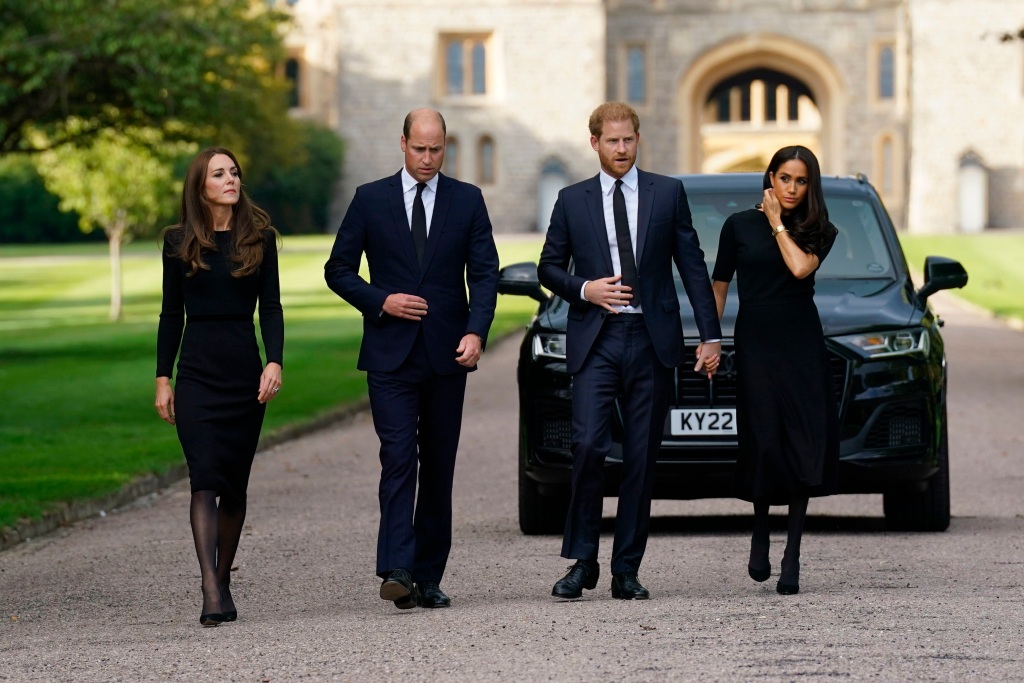From left, Kate, the Princess of Wales, Prince William, Prince of Wales, Prince Harry and Meghan, Duchess of Sussex walk to meet members of the public.