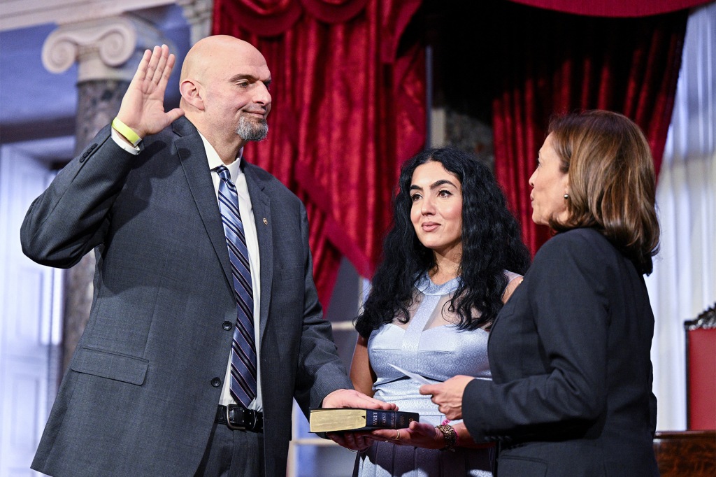 Vice President Kamala Harris administers the ceremonial oath of office to Sen. John Fetterman while his wife Gisele looks on Jan. 3, 2023. 