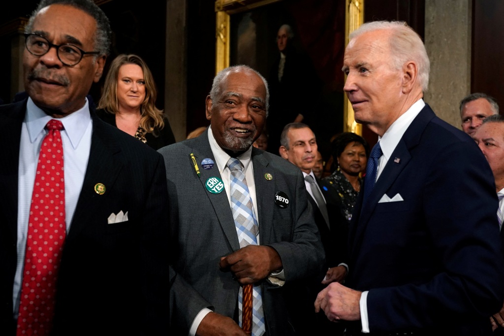 Rep. Danny Davis (center) greets President Joe Biden.