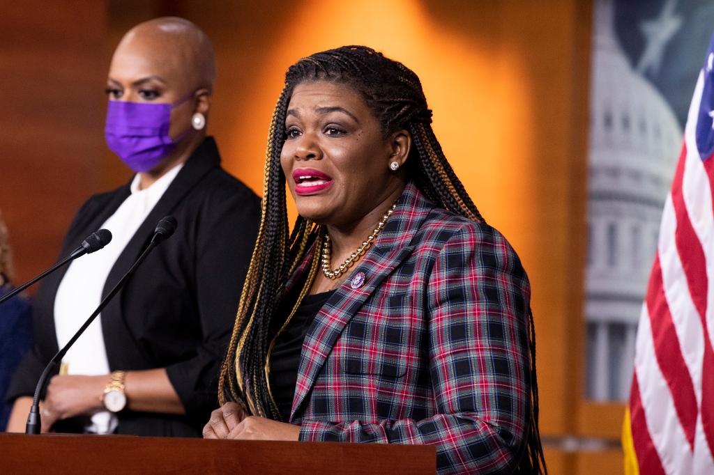 Cori Bush (R) speaks beside Democratic Representative of Massachusetts Ayanna Pressley (L).