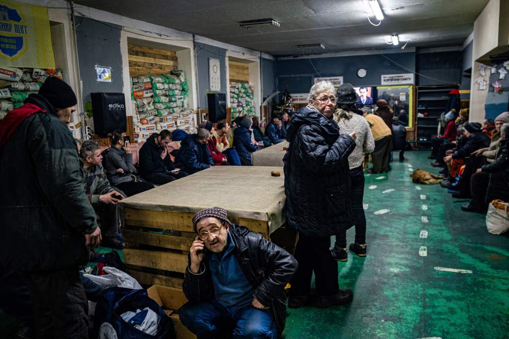 Ukrainians gather at a humanitarian aid center in Bakhmut, on February 27, 2023. 