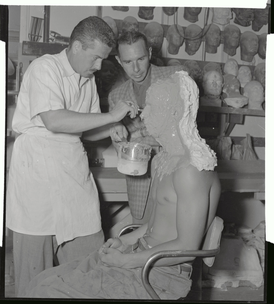 Ricou Browning is shown here as he is being made up as the monster "gillman" for the movie Creature From The Black Lagoon.
