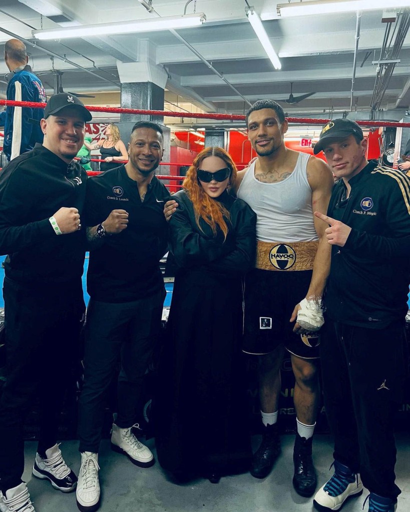 She posed for a few snaps alongside him at his NYC boxing gym. 