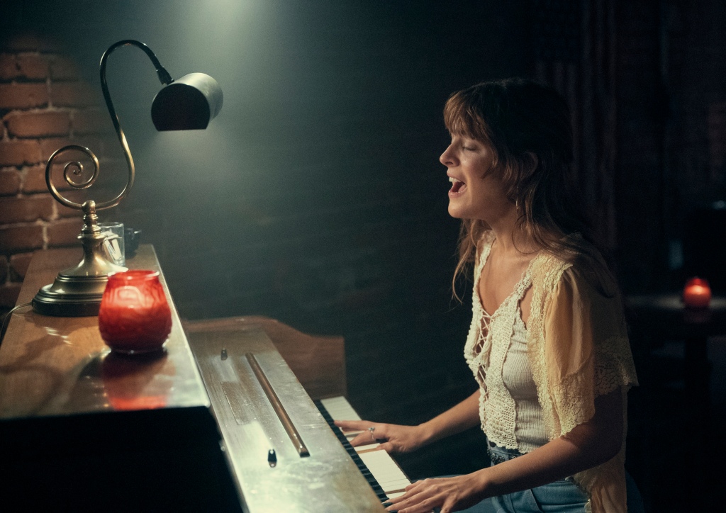 This image released by Amazon shows Riley Keough in a scene from "Daisy Jones & The Six." 