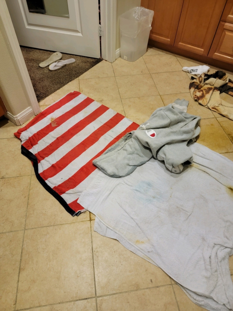 Photos of towels on floor at Carter's death scene.