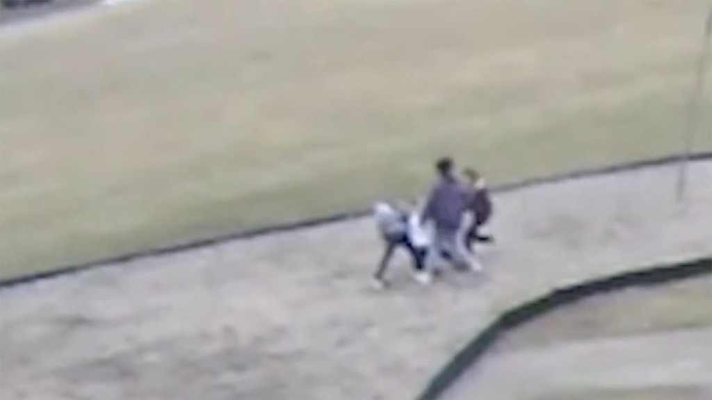 Still from the video shows group seemingly attacking another pupil.