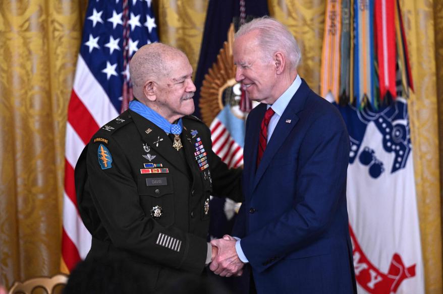 President Biden shakes hands with hero retired Col. Paris Davis, who received the Medal of Honor on Friday.