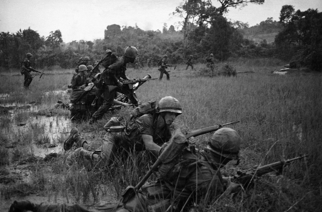 Soldiers in a field during the Vietnam War.