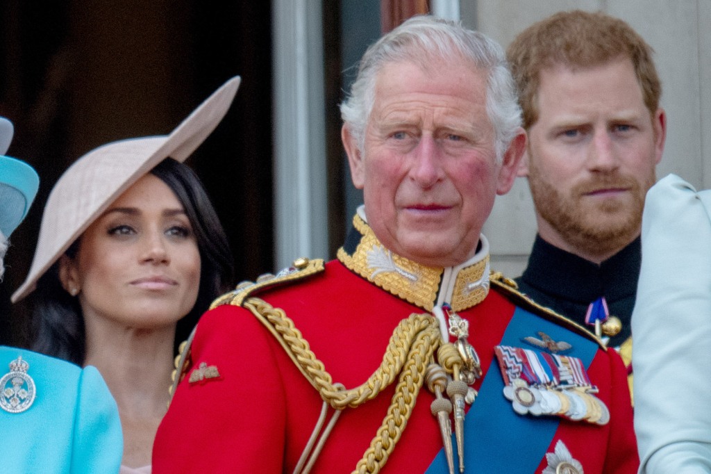 Prince Harry with King Charles and Meghan Markle in 2018.