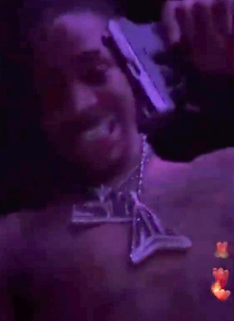 A screen grab from the video of Ja Morant flashing a hand gun at a strip club.