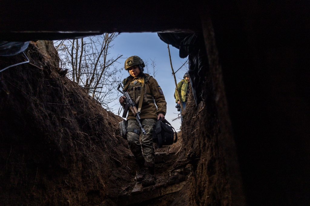 Soldiers from a Ukrainian assault brigade enter a command bunker while waiting for orders to fire a British-made L118 105mm Howitzers on Russian trenches on March 04, 2023 near Bakhmut, Ukraine.