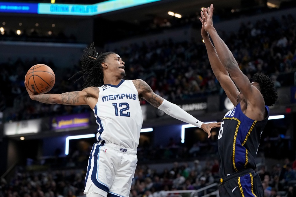 Ja Morant #12 of the Memphis Grizzlies dunks the ball over Jalen Smith #25 of the Indiana Pacers in the third quarter at Gainbridge Fieldhouse on January 14, 2023 in Indianapolis, Indiana. 