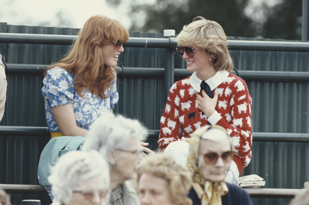 Fergie and the Princess of Wales chat at the Guard's Polo Club in Windsor in 1983. 