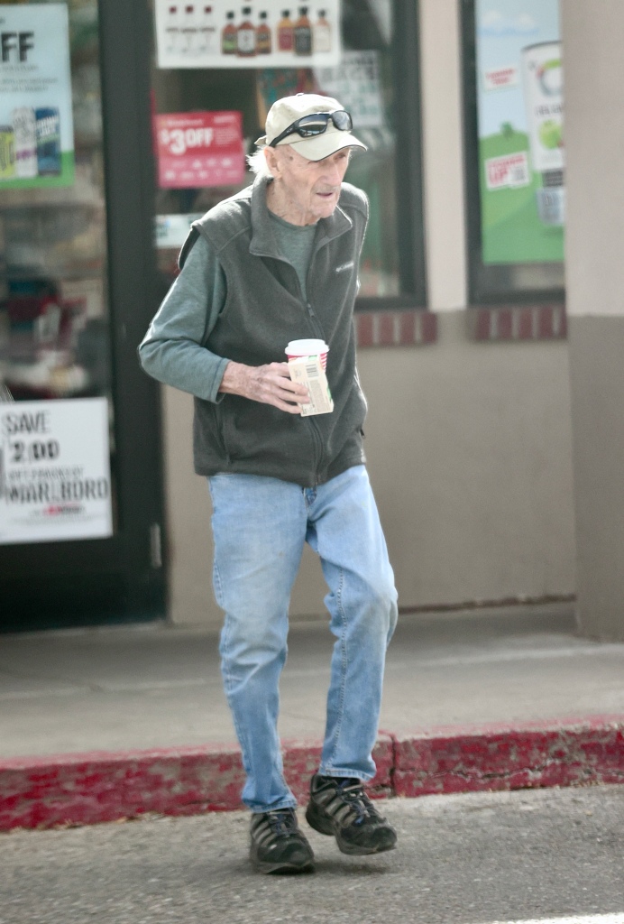 The slender star wore baggy blue jeans and a gray fleece vest as he stopped by a gas station.