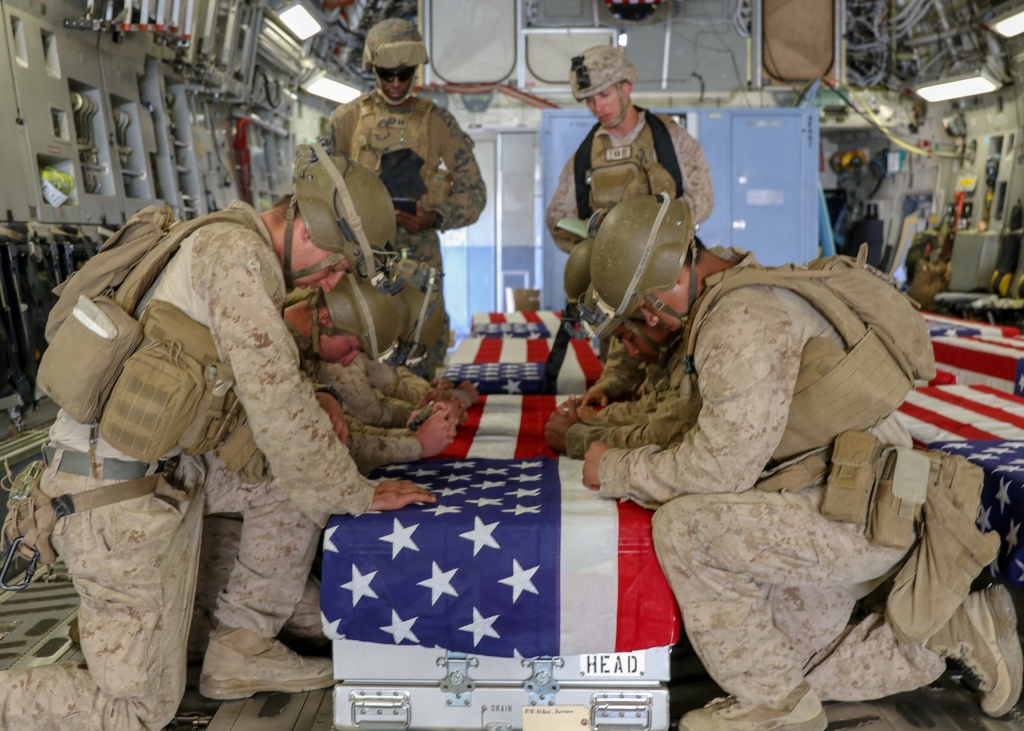 U.S. Marines honor their fallen service members.