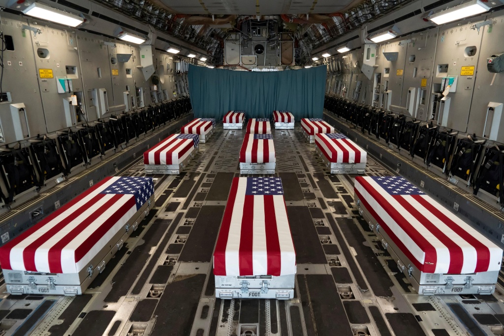 Flag-draped transfer cases of U.S. military service members who were killed by an August 26 suicide bombing at Kabul's Hamid Karzai International Airport line the inside of a C-17 Globemaster II prior to a dignified transfer at Dover Air Force Base, Delaware, U.S., August 29, 2021.   U.S. Marines/Handout via REUTERS THIS IMAGE HAS BEEN SUPPLIED BY A THIRD PARTY.